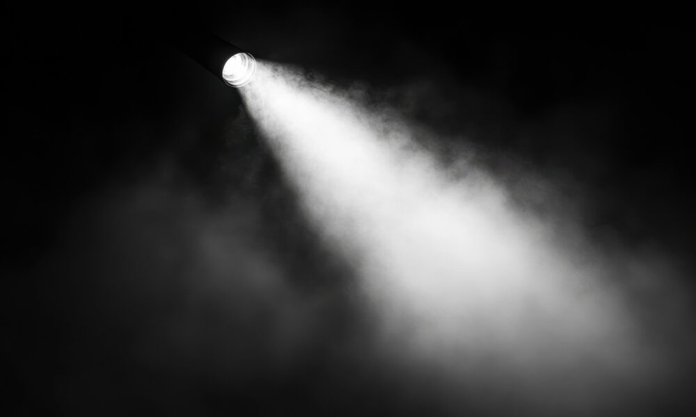 Light cutting through the smoke