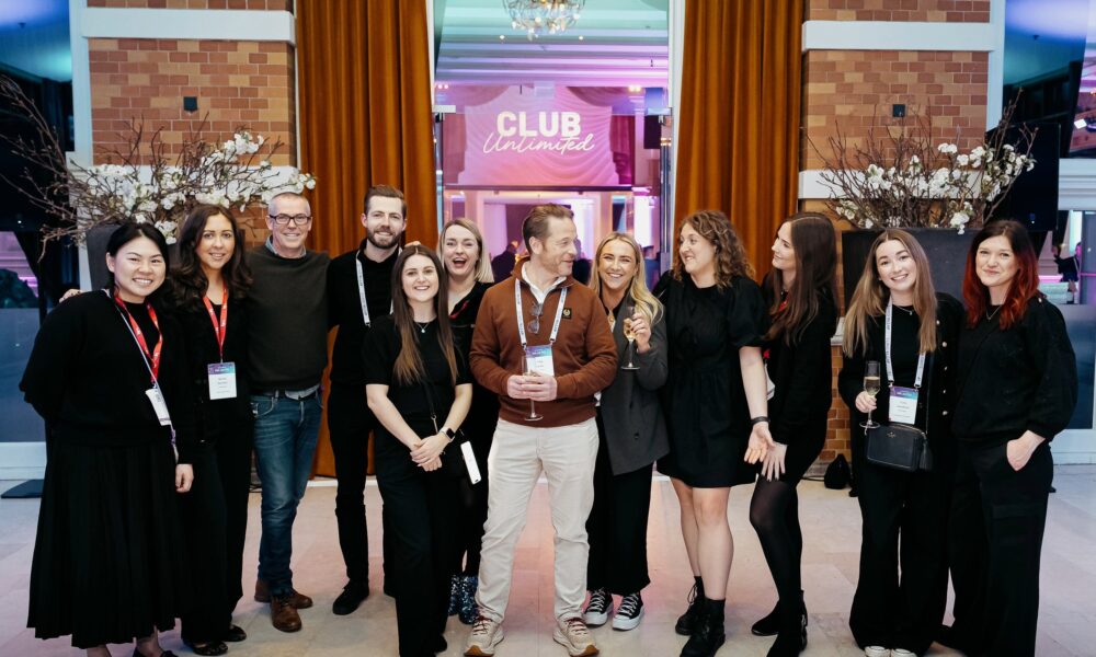Live Group team celebrating the success of an event, representing a top event agency in the UK.