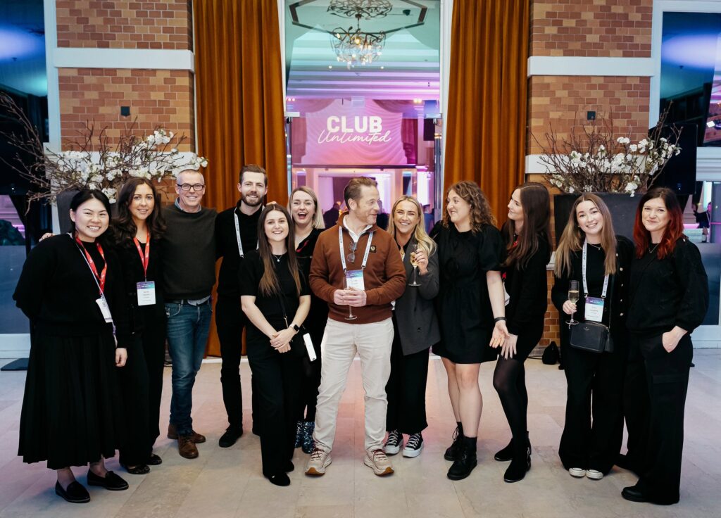 Live Group team celebrating the success of an event, representing a top event agency in the UK.