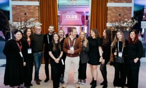 Live Group team celebrating the success of an event, representing a top event agency in the UK.
