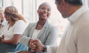 Two business people shaking hands