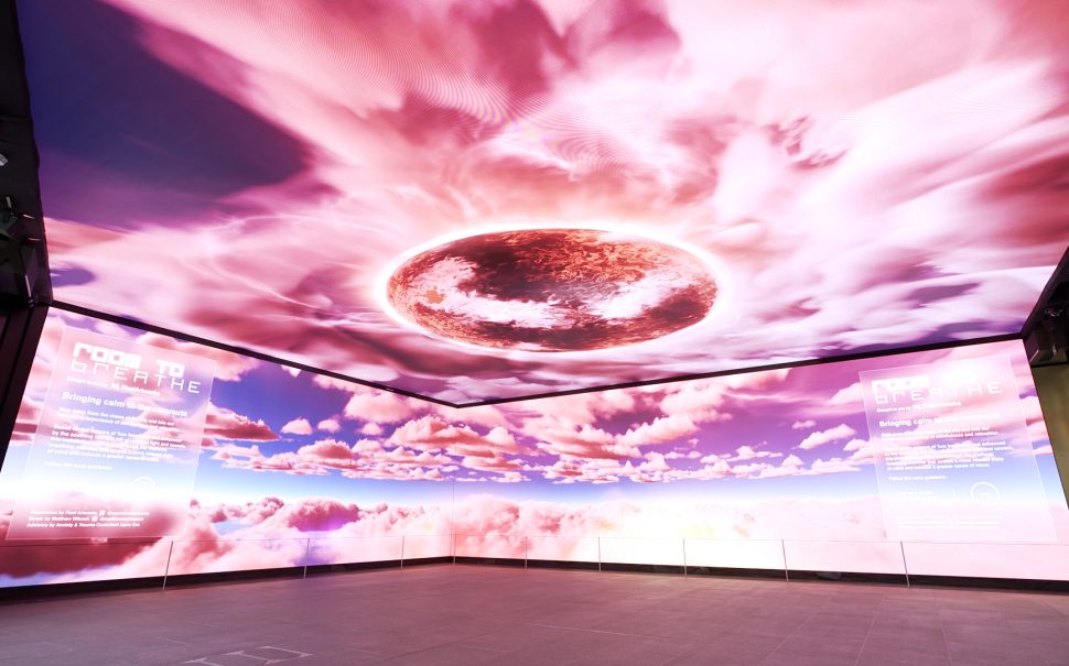 Experiential pop-up event at Outernet London featuring immersive digital screens, branded installations, and attendees exploring the interactive space