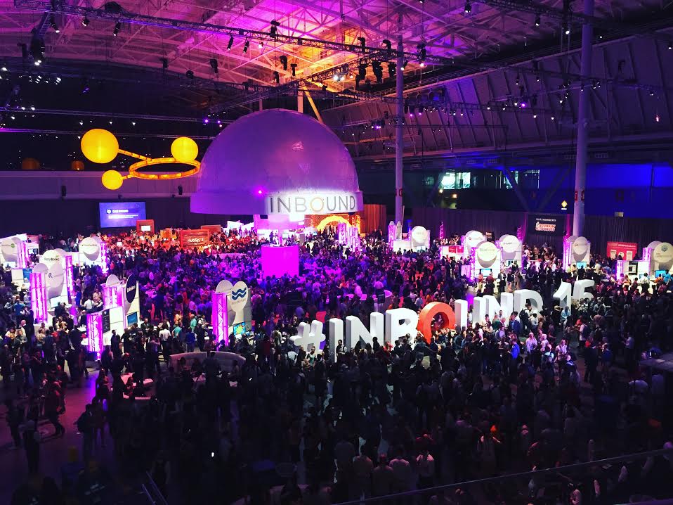 HubSpot INBOUND brand activation event featuring vibrant signage, interactive installations, and attendees engaging with branded experiences in a lively conference setting.