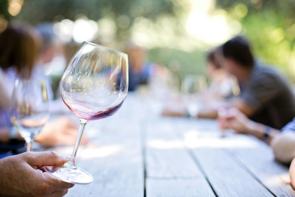 Close-up of a wine glass during a corporate team bonding tasting event