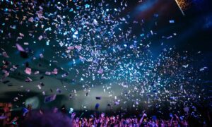 Event marketing example showing audience engagement with money pouring onto the crowd, illustrating ROI and successful campaigns
