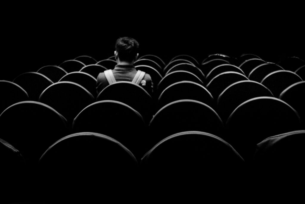 Delegate sitting alone in theatre, signifying individual preferences being met