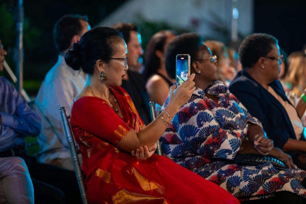 Event delegate on phone, using technology to engage with event.