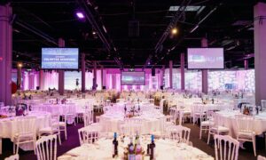 Elegant ballroom prepared for a corporate event, illustrating professional venue sourcing.