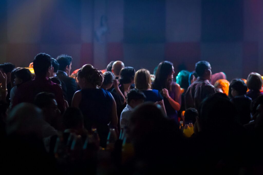 Audience of delegates at an in person event.