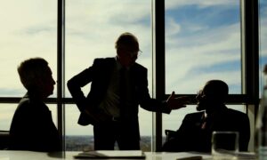 Boardroom with event stakeholders engaged in discussion, exemplifying event stakeholder engagement and communication.