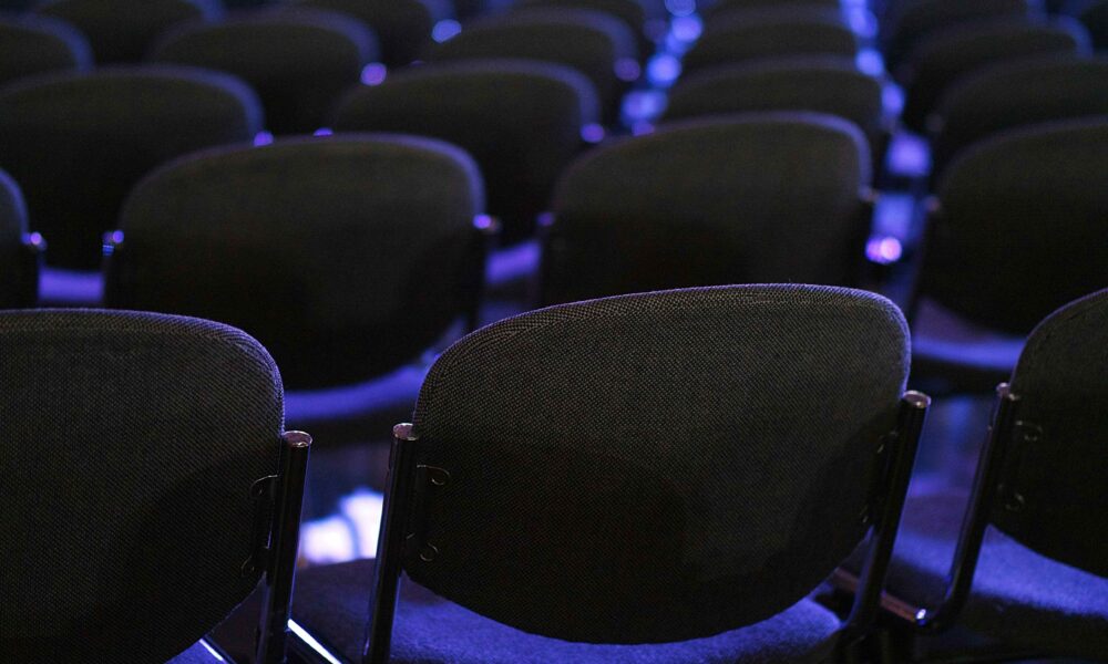 Chairs in an auditorium set up for corporate conference