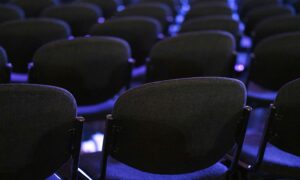 Chairs in an auditorium set up for corporate conference