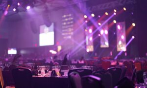 Corporate awards ceremony in event venue.