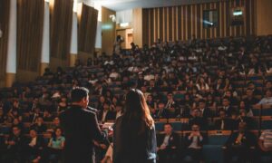 Government conference with speakers - example of public sector event